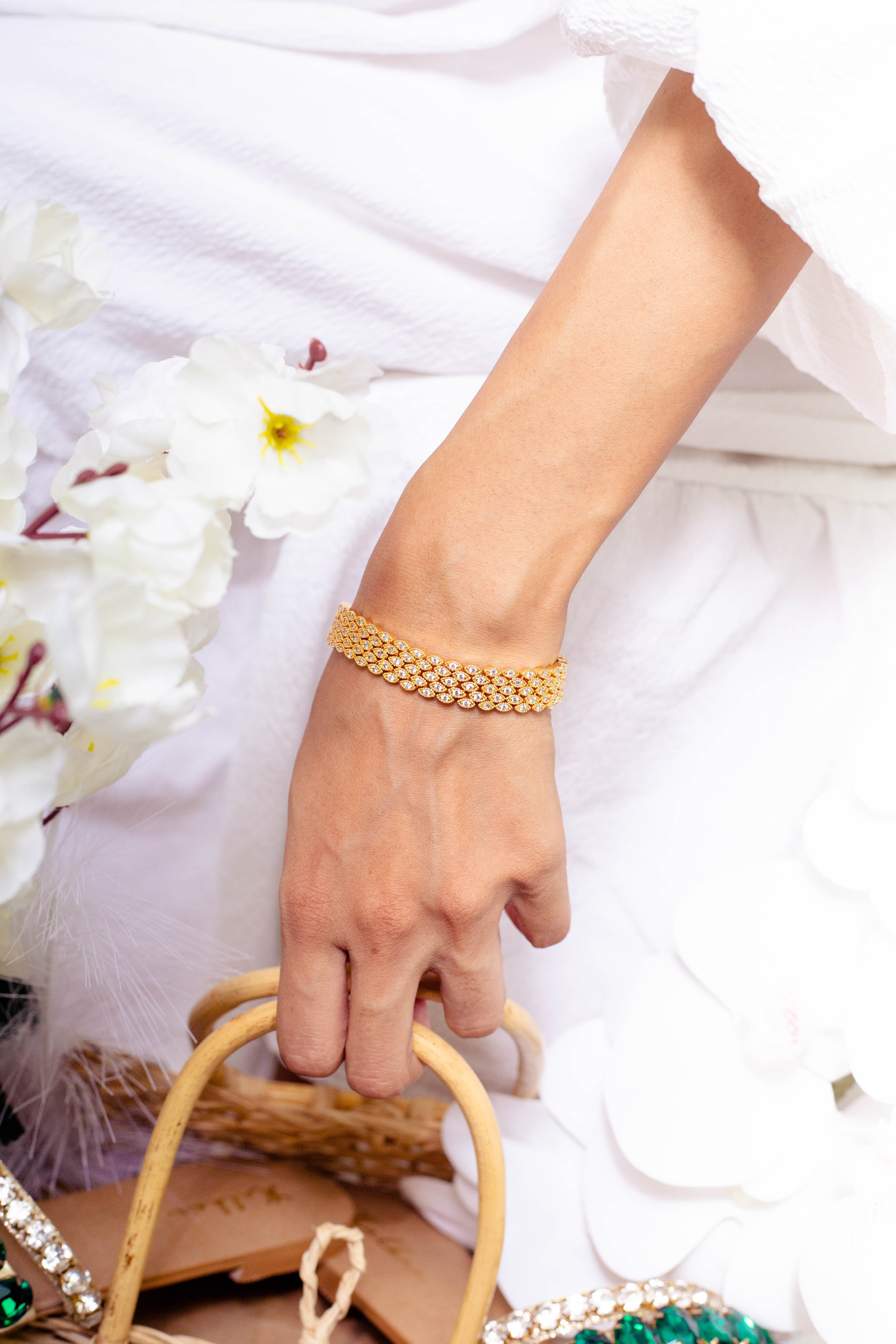 Jouel gold bracelet editorial photograph